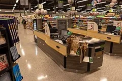 A supermarket checkout aisle with tills