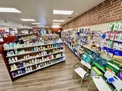 The interior of a pharmacy shop with shelves of products