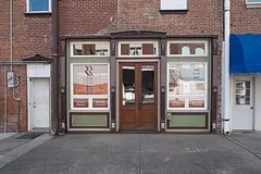 A small shop storefront with display windows