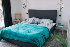 A cozy modern bedroom with a large bed